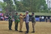 Pelaksanaan program TNI Manunggal Membangun Desa (TMMD)